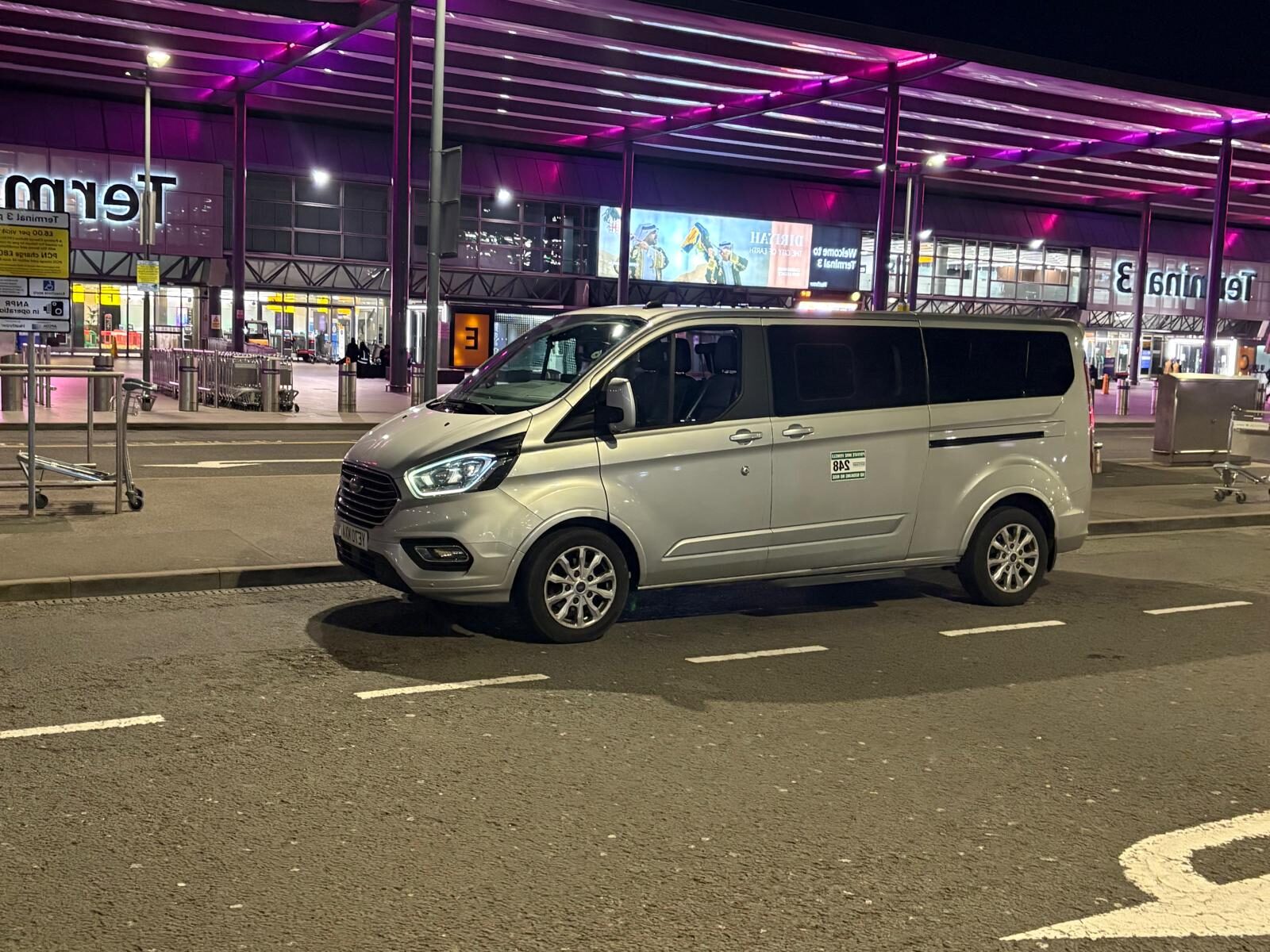 Shaun 8 seater van is is parked outside Heathrow Airpost and is waiting for the Passengers